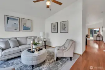 Relax in the formal living room featuring vaulted ceilings.