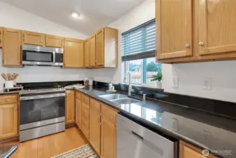 Vaulted ceilings add to the light and airy feel of the open kitchen and dining area.