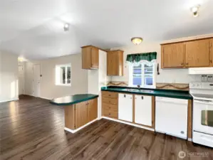 The kitchen includes a breakfast bar, making it ideal for entertaining.