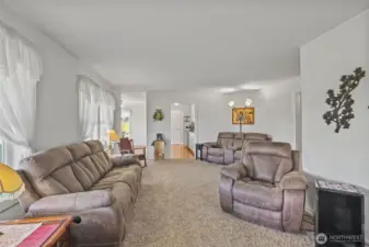 Living room looking into kitchen and dining