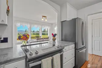 Kitchen open alcove pass through to dining room looking out at dining room and views!