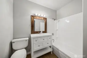 2nd bathroom on main level. Located outside bedrooms 3 and 4.