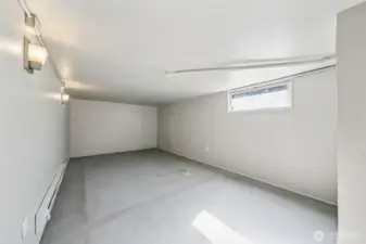 Another basement room used as a bedroom.