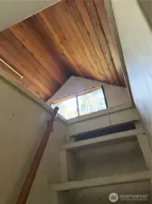 There is a small loft above the bedroom.