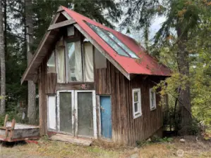 The detached "shop" is on the second parcel. In the tax records it is referred to as a garage...