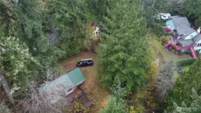 The cabin and the shop are nestled in the trees, with westerly views...