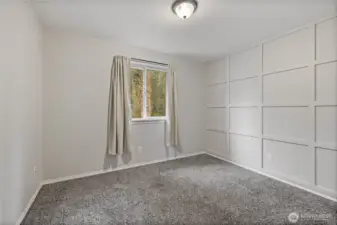 Bedroom #3 is situated to the left of the laundry room and at the back of the home