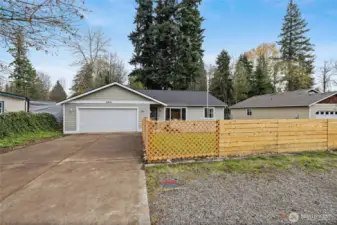 Long driveway leads to two car heated garage!