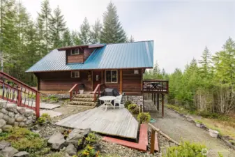 The main entrance to the house showing the large composition deck.