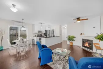 Living room features a cozy propane fireplace and ceiling fan.