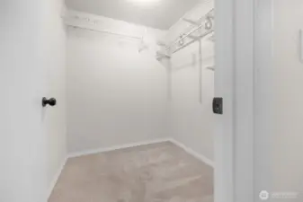 Walk-in closet in primary bedroom.