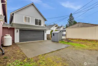 Spacious double garage off alley with extra space for shop or storage.