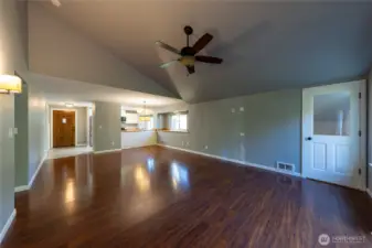 Vaulted ceilings add architectural interest and warmth to the main living space.