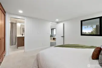 Shot showing 3/4 bath off primary bedroom