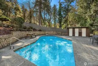 The centerpiece of this remarkable property is the beautiful in-ground pool, surrounded by lush landscaping and providing the perfect oasis for relaxation and entertaining.