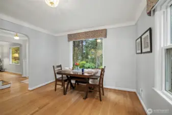 The dining room has a serene green lush view to enjoy while you dine.