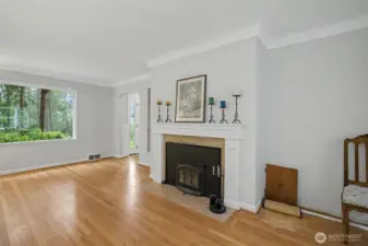 A classic fireplace with elegant millwork is a beautiful addition bringing warmth and ambiance to the room.