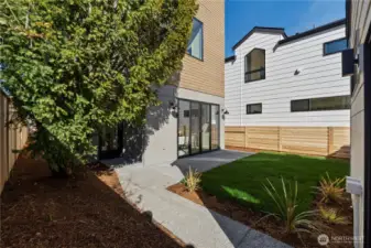 Fully fenced yard with patio off the family room