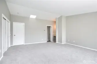 Primary bedroom (with the windows and deck to your back in this photo).