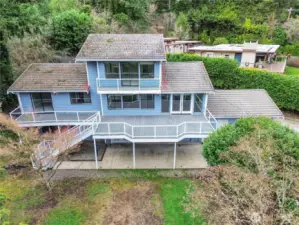 Spanish tile roof for durability in the Pacific NW. Trex decking w plexiglass railing.