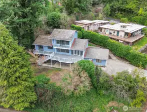 Private lot. Secluded dead-end road. This photo is from southeast side of the lot. Check out the majesty of this home! Also, to the left looks "just" like fence, but it's a super cute tree house!!