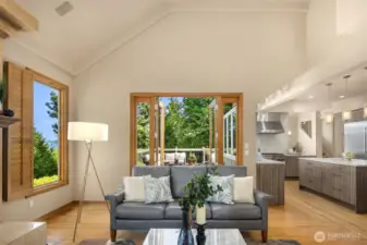 The family room is nicely connected to the kitchen. A second set of French doors opens to the deck. Lots of windows let the natural light flood in.