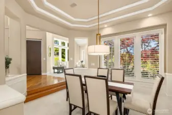 Plantation shutters, and tray ceilings add another level of sophistication to the dining room.
