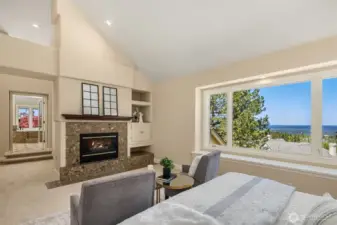 Primary suite includes a wonderful gas fireplace. The window seat perfectly balances the window and the extensive views