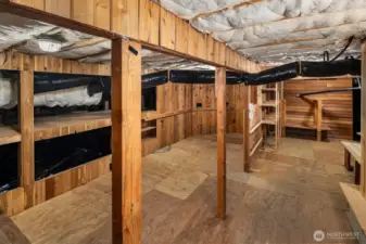 Large, full height storage area under the house, accessed under the deck. Such a great space for outdoor gear, Holiday storage and more. Fully weather proof.