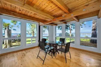 Dining area with corner windows for wrap around water/mountain views.