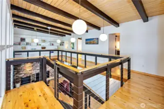 Two bedrooms on the upper floor and the shelves to display art work or a library collection.