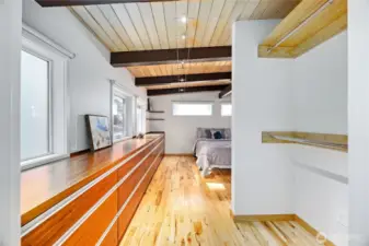 Storage carries through the bedroom and in to the closet