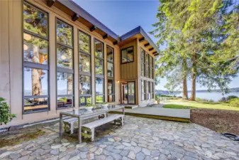 Another view of the patio, deck and the waterside of the home.