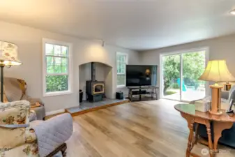 Cozy wood burning stove in Family room with sliding door to back deck and private fully fenced back yard!