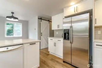 Barn door leads to laundry room