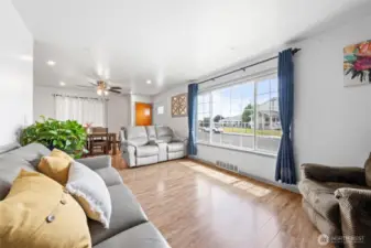Large front window lets in lots of natural light to the living and dining spaces.