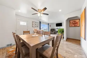 Dining space open to living room and kitchen.