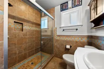 Beautifully tiled main floor bathroom.