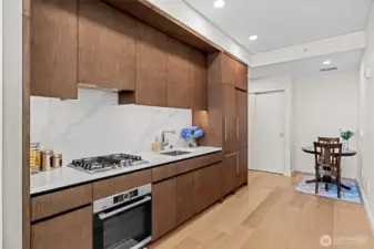 Carrara Marble countertops and backsplash. Bosch appliances.