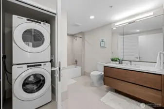 The door opens to the full-sized washer and dryer.