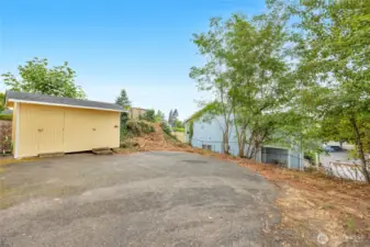 Extra parking spaces with additional storage shed for units