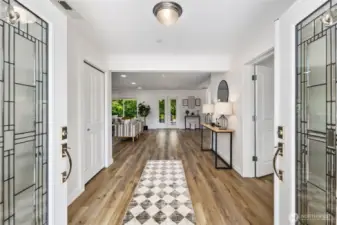 French front doors lead to extra wide entry.