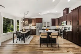 Beautiful eat-in kitchen with large island, dining adjacent.