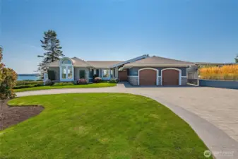 Pristine street approach and circular driveway