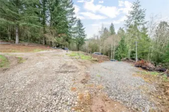 Left to flat building site. Right goes to outbuildings