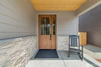 Stone work adds to the beachy modern Craftsman style of this home.