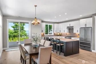 Partial water view from the dining room & from the kitchen...making clean up a little more enjoyable!  Expansive dining area would easily allow for a table for 10 or 12