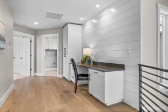 Custom built ins provide desk area & pantry style cabinetry for generous storage.