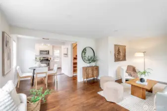 Light filled living room with original hardwood floors and inviting flow.