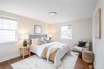 Spacious main level bedroom with peaceful natural light.